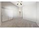 Neutral bedroom with ceiling fan, closet, and entry doors at 10253 E Indigo Dr, Scottsdale, AZ 85255