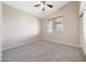 Bright bedroom with neutral paint, carpet, window with blinds, and closet at 10253 E Indigo Dr, Scottsdale, AZ 85255