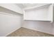 Spacious walk-in closet with metal hanging bars for optimal clothing storage at 10253 E Indigo Dr, Scottsdale, AZ 85255