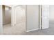 Neutral hallway showcasing carpeted flooring and doorways leading to various rooms in the home at 10253 E Indigo Dr, Scottsdale, AZ 85255