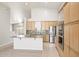 Bright kitchen with an island, stainless steel appliances, and tile flooring at 10253 E Indigo Dr, Scottsdale, AZ 85255