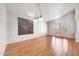 Open living space featuring wood floors, bright lighting, and multiple windows at 10253 E Indigo Dr, Scottsdale, AZ 85255
