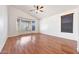 Living room with wood flooring and window with blinds at 10253 E Indigo Dr, Scottsdale, AZ 85255