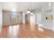 Spacious open-concept living area with hardwood floors and abundant natural light at 10253 E Indigo Dr, Scottsdale, AZ 85255