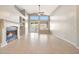 Living room area offers natural light with vaulted ceilings, fireplace and sliding glass door access to a patio at 10253 E Indigo Dr, Scottsdale, AZ 85255