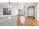 Bright living room with wood floors, tall ceilings, and ample windows at 10253 E Indigo Dr, Scottsdale, AZ 85255