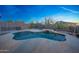 Serene pool area featuring desert landscaping and privacy fencing for leisure and relaxation at 10253 E Indigo Dr, Scottsdale, AZ 85255