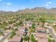 Picturesque aerial shot of a desert community with solar panels and mountain views at 10591 E Morning Star Dr, Scottsdale, AZ 85255