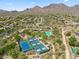 Community aerial view with pickleball, pool, clubhouse and mountain views at 10591 E Morning Star Dr, Scottsdale, AZ 85255