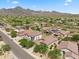 Scenic aerial view of a desert community with mountain backdrop and lush landscaping at 10591 E Morning Star Dr, Scottsdale, AZ 85255