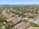 Expansive aerial view of a desert community with well-maintained streets and tile roofs at 10591 E Morning Star Dr, Scottsdale, AZ 85255