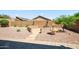 Backyard featuring a stone fountain and stone seating area, surrounded by desert landscaping at 10591 E Morning Star Dr, Scottsdale, AZ 85255