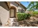 Inviting front entrance featuring a security door, decorative windows, and manicured shrubs at 10591 E Morning Star Dr, Scottsdale, AZ 85255