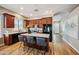 Open kitchen with an island, dark cabinets and stainless steel appliances at 10591 E Morning Star Dr, Scottsdale, AZ 85255