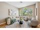 Comfortable living room with large windows, hardwood floors and stylish neutral furniture at 10591 E Morning Star Dr, Scottsdale, AZ 85255