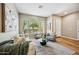 Bright living room with large windows and stylish neutral furniture at 10591 E Morning Star Dr, Scottsdale, AZ 85255