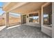 Spacious covered patio with tiled flooring and multiple sliding glass doors at 10591 E Morning Star Dr, Scottsdale, AZ 85255