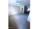 Carpeted bedroom with a ceiling fan and closet with mirrored sliding doors at 1075 E Chandler Blvd # 220, Chandler, AZ 85225
