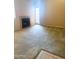 Inviting living area with plush carpeting, a stone fireplace, and a bright glass door at 1075 E Chandler Blvd # 220, Chandler, AZ 85225