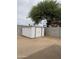 A backyard with sand, a shed, a playhouse, and a large tree at 11802 N 25Th Ave, Phoenix, AZ 85029