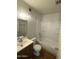 Cozy bathroom featuring a shower-tub combo and a vanity with storage at 11802 N 25Th Ave, Phoenix, AZ 85029