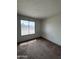 Bright bedroom with carpeted floors and a window, offering natural light at 11802 N 25Th Ave, Phoenix, AZ 85029