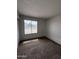 Comfortable bedroom with carpeted flooring and a window, providing a cozy space at 11802 N 25Th Ave, Phoenix, AZ 85029