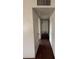 Hallway with white walls and doors, offering access to rooms at 11802 N 25Th Ave, Phoenix, AZ 85029