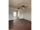 Spacious living room with a ceiling fan, connecting to the backyard through a glass sliding door at 11802 N 25Th Ave, Phoenix, AZ 85029
