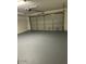 Spacious two car garage with light gray flooring at 11845 W Edgemont Ave, Avondale, AZ 85392