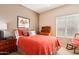 Cozy bedroom with a vintage desk, and comfortable rocking chair at 11861 E Becker Ln, Scottsdale, AZ 85259