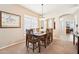 Well-lit dining room featuring carpet, neutral paint, and a window that enhances the room's appeal at 11861 E Becker Ln, Scottsdale, AZ 85259