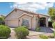 Single-story home boasts a two-car garage, desert landscaping, and a neutral color palette at 11861 E Becker Ln, Scottsdale, AZ 85259