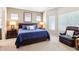 Spacious main bedroom suite with plush carpeting, a sitting area, and bright windows at 11861 E Becker Ln, Scottsdale, AZ 85259