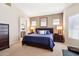 Elegant main bedroom suite featuring neutral tones, plush carpeting, and ample natural light at 11861 E Becker Ln, Scottsdale, AZ 85259