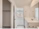 This bathroom has an access to the bedroom and features a modern vanity with neutral tiling at 12013 E Primrose Ln, Florence, AZ 85132