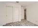 The bedroom is equipped with neutral carpet, closet with sliding doors, and access to another room at 12013 E Primrose Ln, Florence, AZ 85132