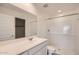 Clean bathroom with a white vanity, and a tiled shower and tub combination at 12142 E Sunflower Ln, Florence, AZ 85132