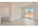 Bright bedroom boasts tile floors, neutral walls, and outdoor access at 12142 E Sunflower Ln, Florence, AZ 85132
