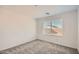 Bright bedroom features plush carpeting, window with blinds, and neutral paint scheme at 12142 E Sunflower Ln, Florence, AZ 85132