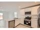 Bright kitchen features stainless steel appliances, white cabinets, and a functional layout at 12142 E Sunflower Ln, Florence, AZ 85132