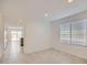 Inviting living room with tile floors, neutral walls, and access to the kitchen at 12142 E Sunflower Ln, Florence, AZ 85132