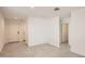 Bright living room with neutral walls, modern tile flooring, and ample natural light at 12142 E Sunflower Ln, Florence, AZ 85132