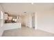 Open living area with modern tile, a kitchen, and natural light at 12142 E Sunflower Ln, Florence, AZ 85132
