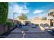 Charming backyard with fire pit, outdoor lounge area, and string lights for evening enjoyment at 12152 W Briles Rd, Peoria, AZ 85383