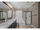 Full bathroom features a granite countertop vanity, soaking tub and walk-in shower at 12152 W Briles Rd, Peoria, AZ 85383