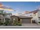 Charming single-story home with a tile roof, brick accents, and a well-manicured front yard at 12152 W Briles Rd, Peoria, AZ 85383