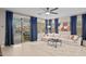 Open living room with patio access featuring large windows and neutral decor at 12152 W Briles Rd, Peoria, AZ 85383