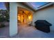 Covered patio with a ceiling fan, a grill and comfortable seating, perfect for outdoor relaxation at 13295 N 153Rd Ln, Surprise, AZ 85379