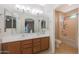 Bright bathroom boasts double sinks, generous counter space, and shower and bath tub at 13295 N 153Rd Ln, Surprise, AZ 85379